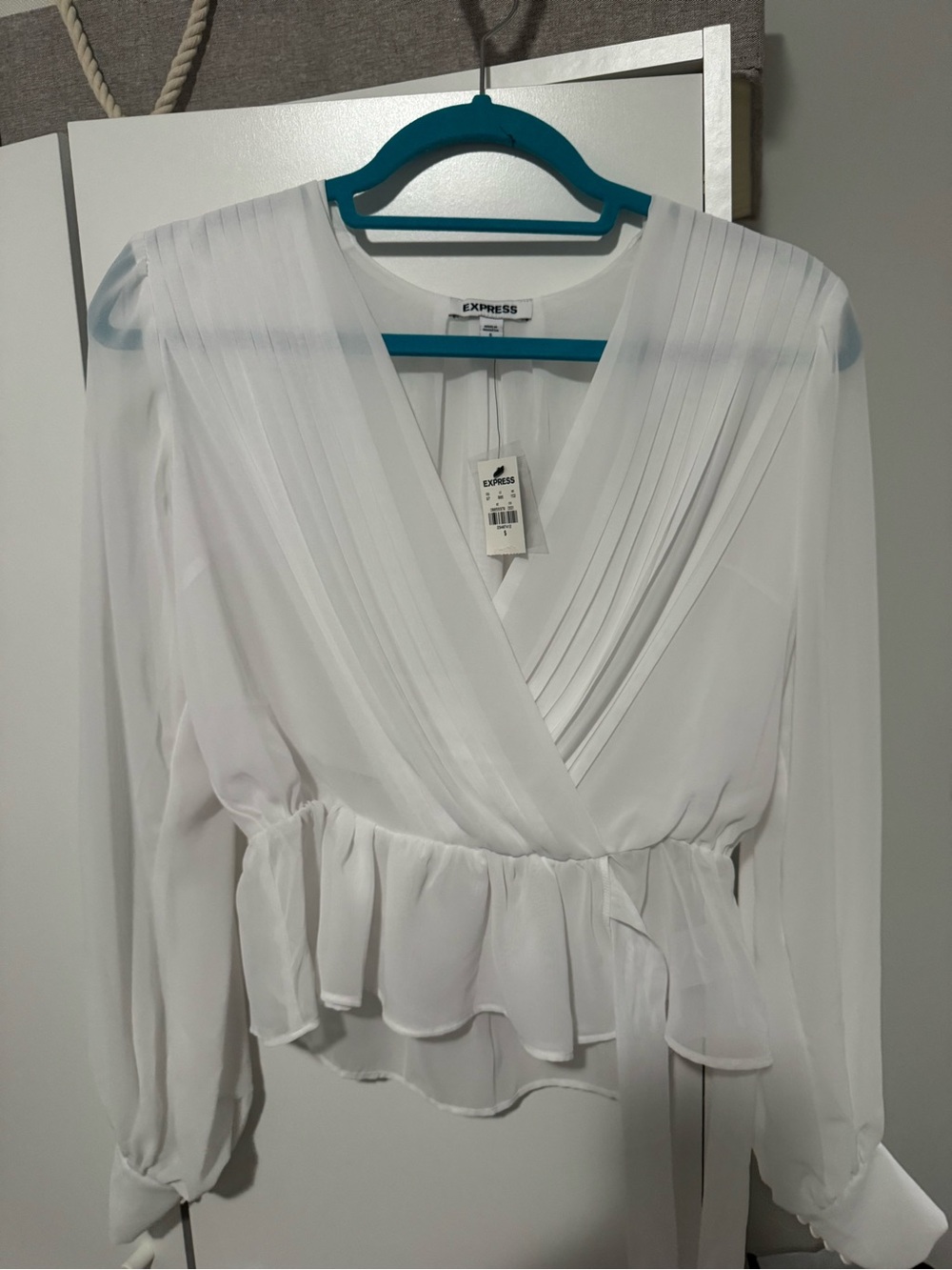 White flowy top.